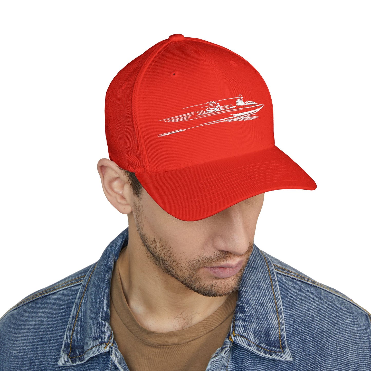 Red cap with a white graphic worn by a person on a white background