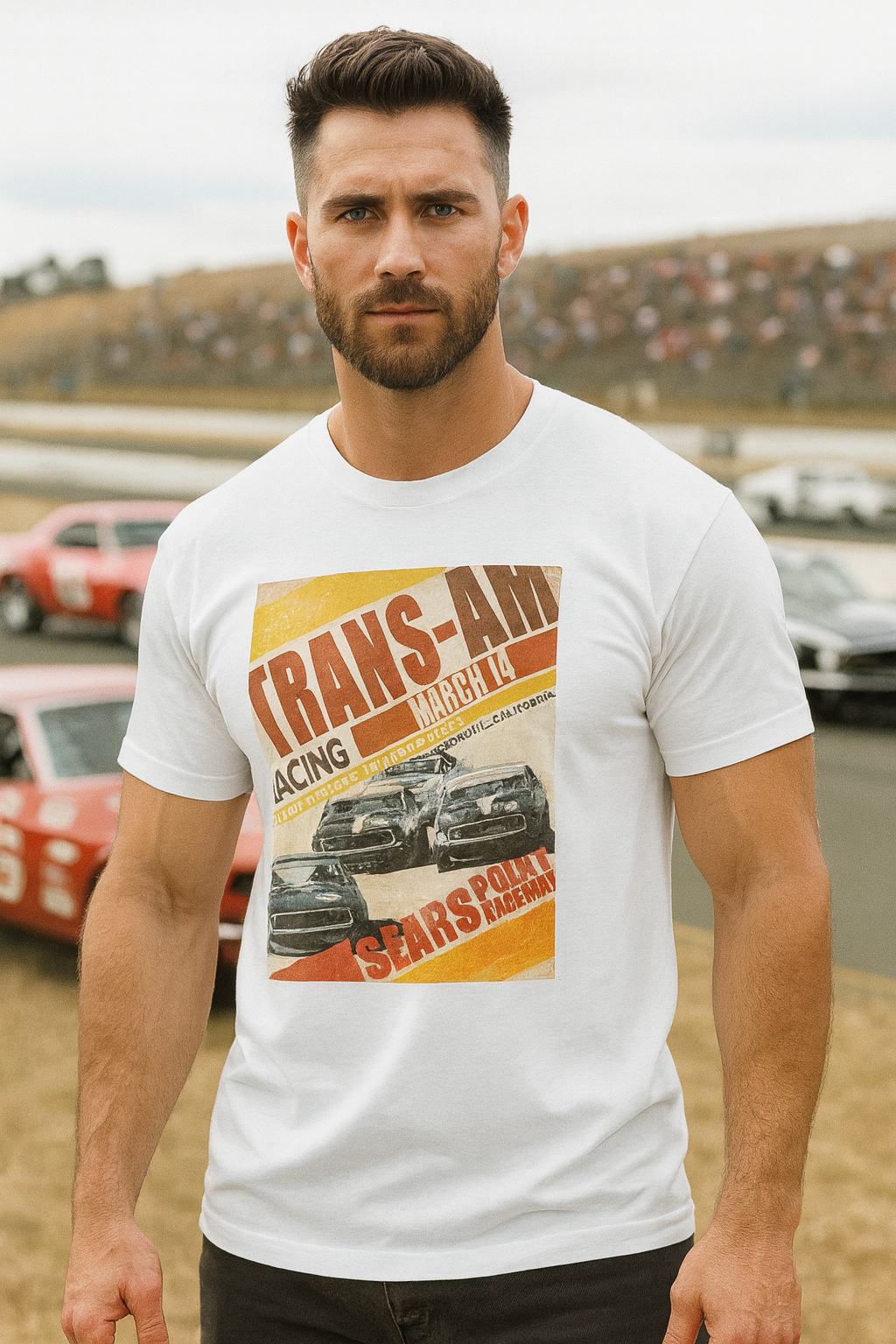 Man wearing a white t-shirt with a Trans-Am graphic design of vintage racing cars and text.