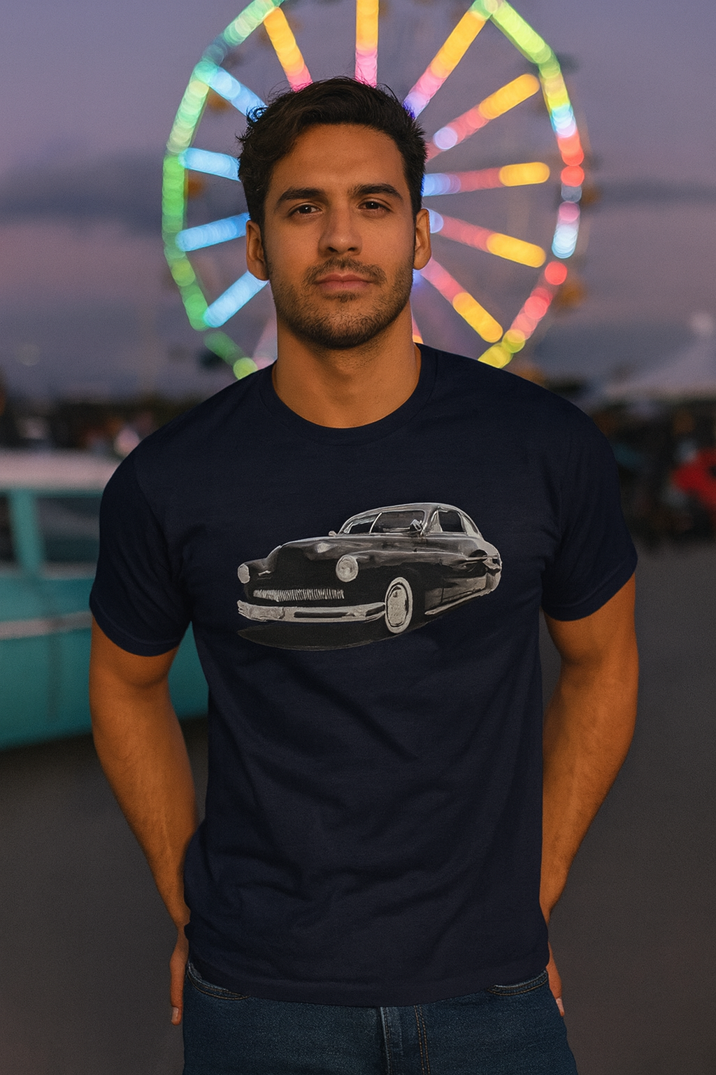 Man wearing a black bonspeed t-shirt with a car graphic in front of a colorful Ferris wheel.