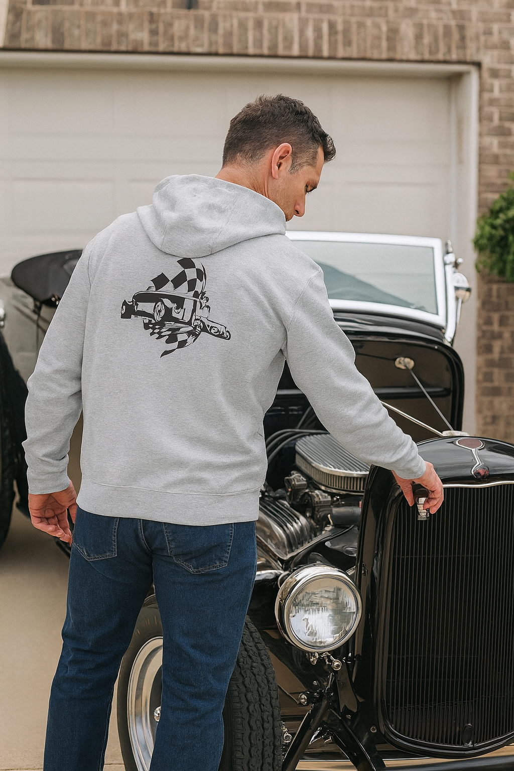 Man wearing a bonspeed hoodie with a Hot Rod logo.