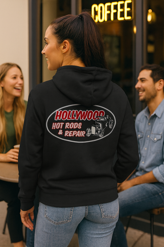 Person wearing a black bonspeed 
hoodie with 'Hollywood Hot Rods & Repair' design, standing outdoors.