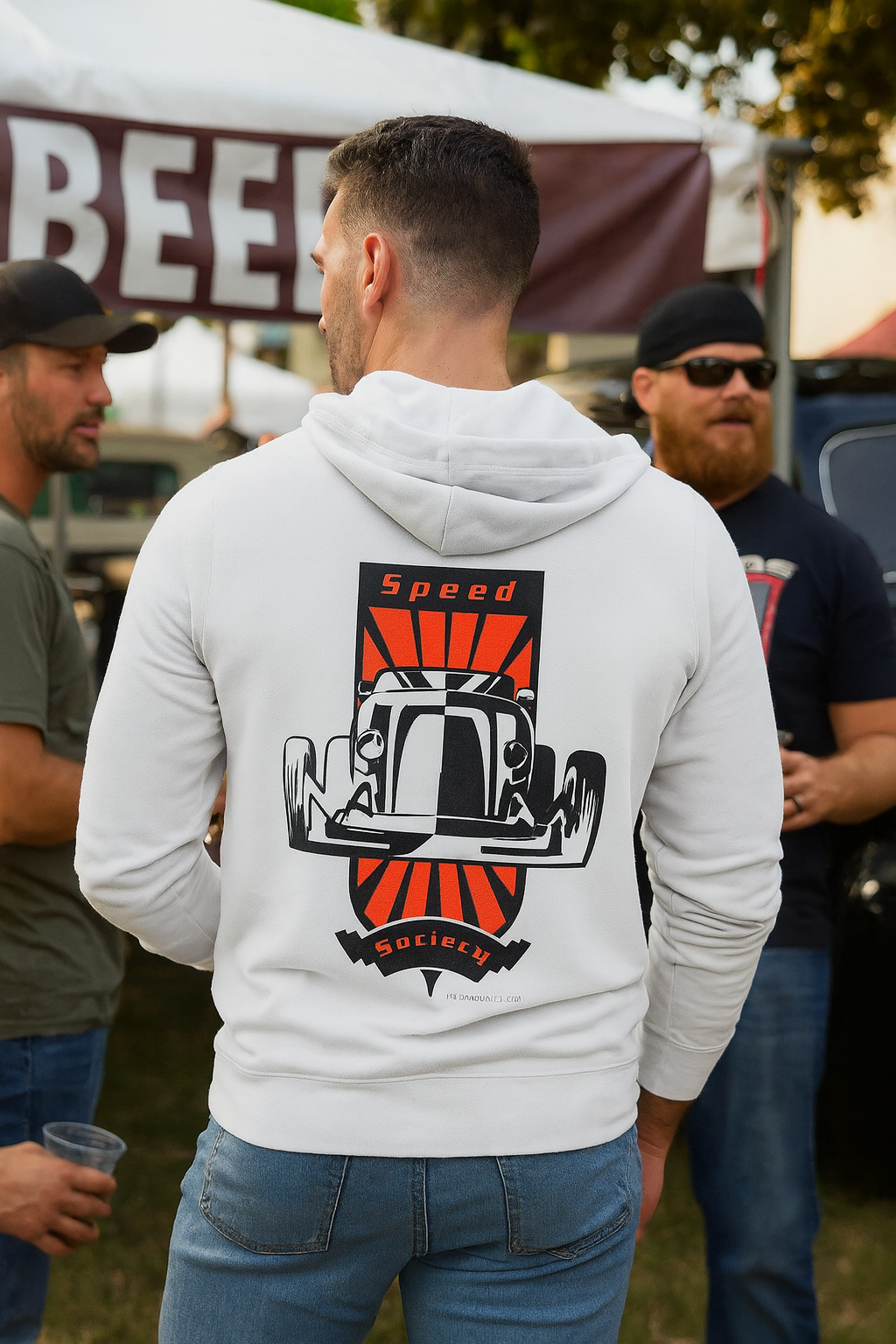 Man wearing a white bonspeed hoodie with a graphic hot rod design