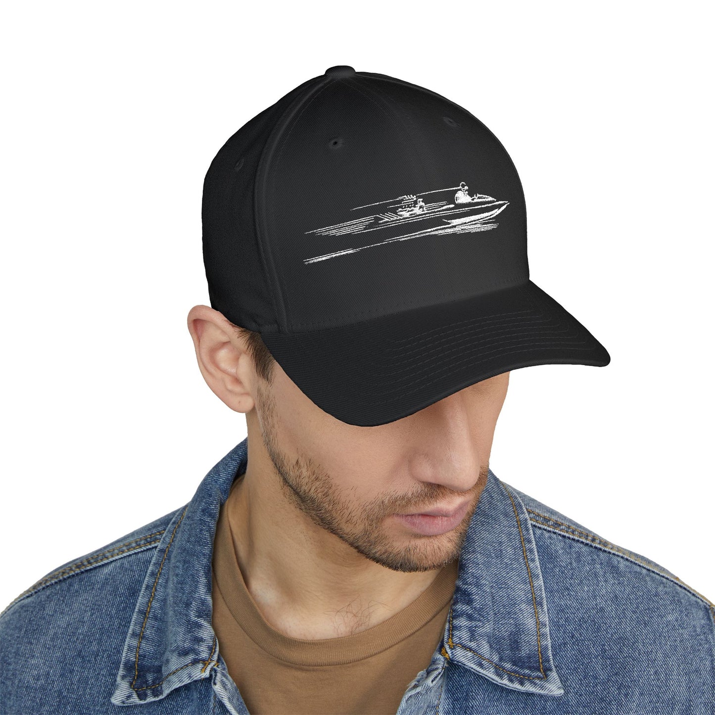 Black cap with boat design worn by a person on a white background